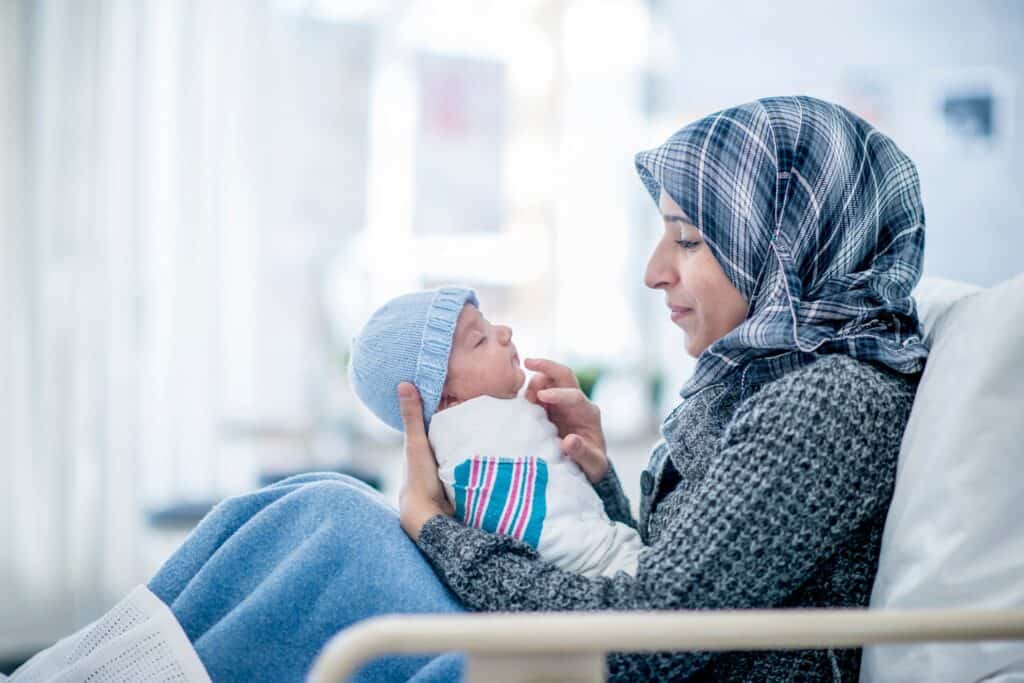 Moslem woman with her newborn baby in a hospital